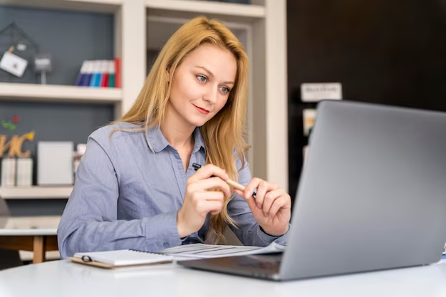 Person checking attested certificates online using a laptop